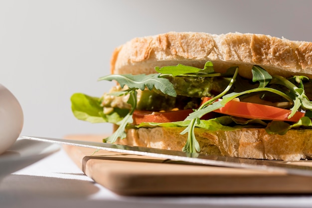 Close-up of toast sandwich with tomatoes and greens