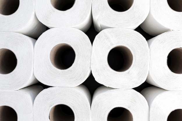 Free photo close-up toilet paper rolls aligned