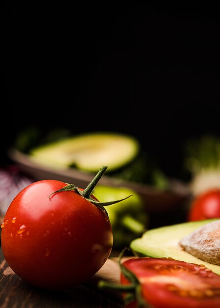 Close-up tomato and dark blurred background