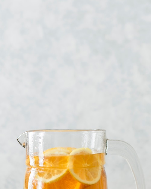 Close-up of top of glass with lemon slices