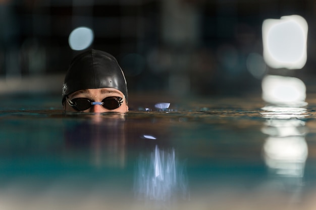 Close up of the top of a male swimmers head