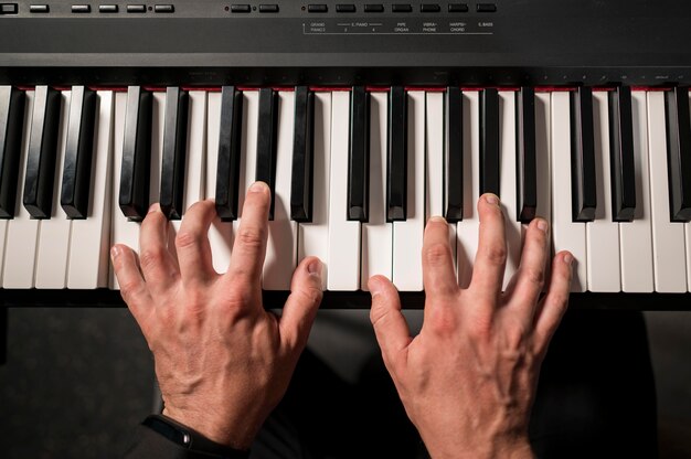 Close-up top view professional keyboard player