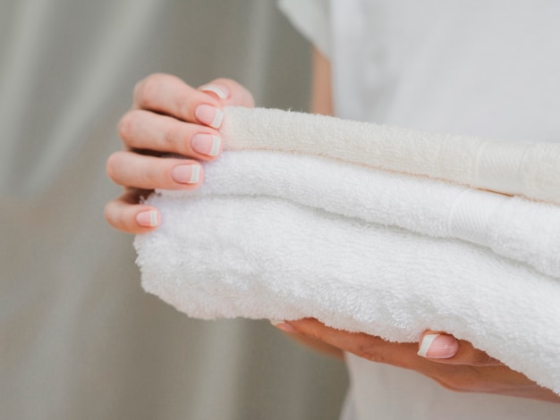Close up of towels held in hands