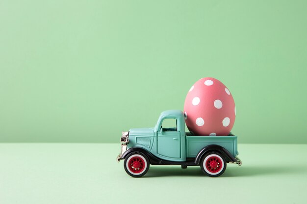 Close up on toy car with easter eggs