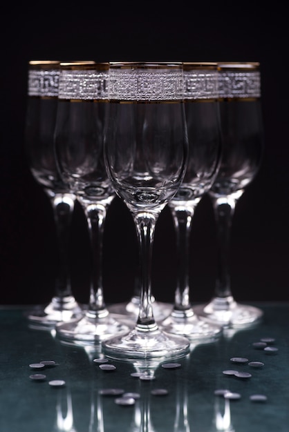 Close-up of transparent elegant glasses on reflecting table