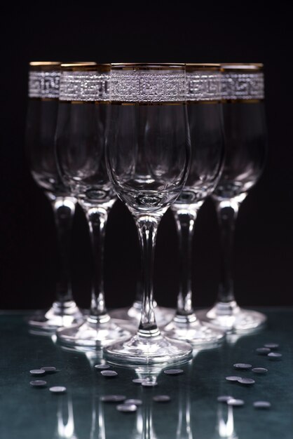 Close-up of transparent elegant glasses on reflecting table