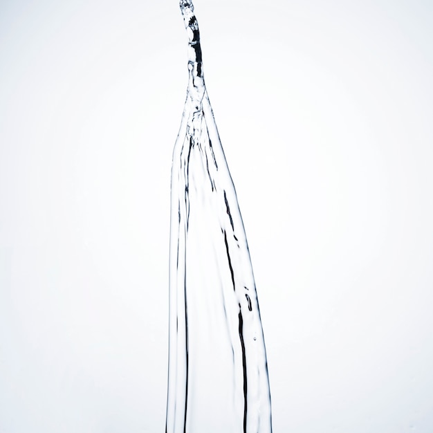 Close-up transparent liquid shape on light background