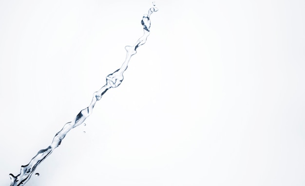 Close-up transparent liquid shape on white background with copy space