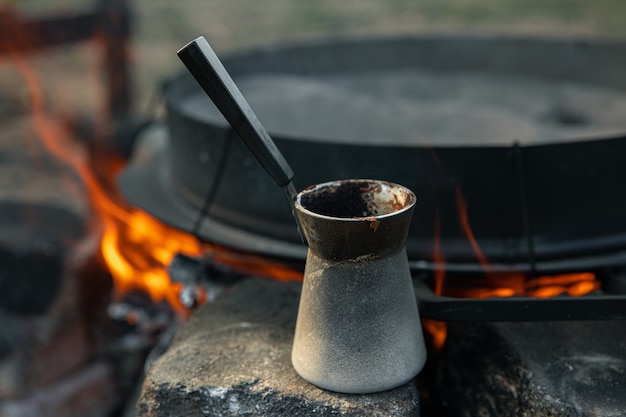 Close-up of a Turk with coffee on a blurred background.