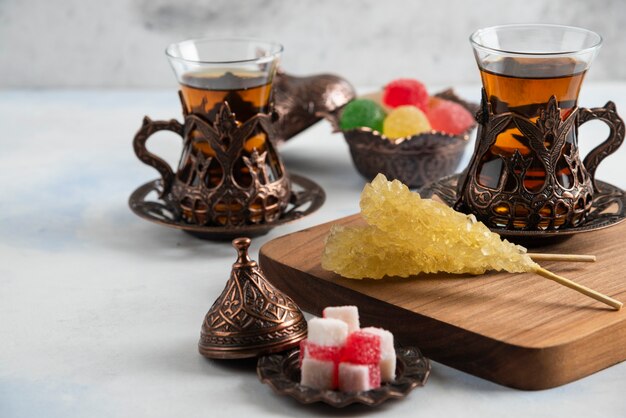 Close up of Turkish tea set. Sweet candies and fragrant tea