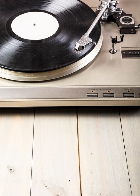 Close-up of turntable vinyl record player on wooden table