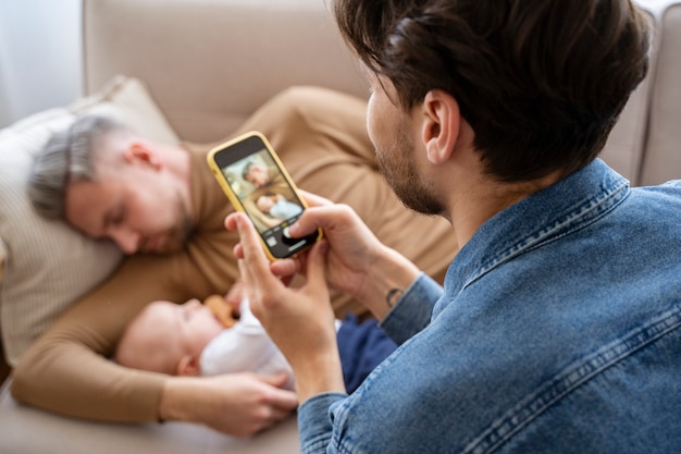 Free photo close up on two dads and a baby