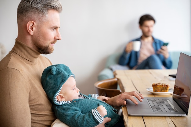 Free photo close up on two dads and a baby