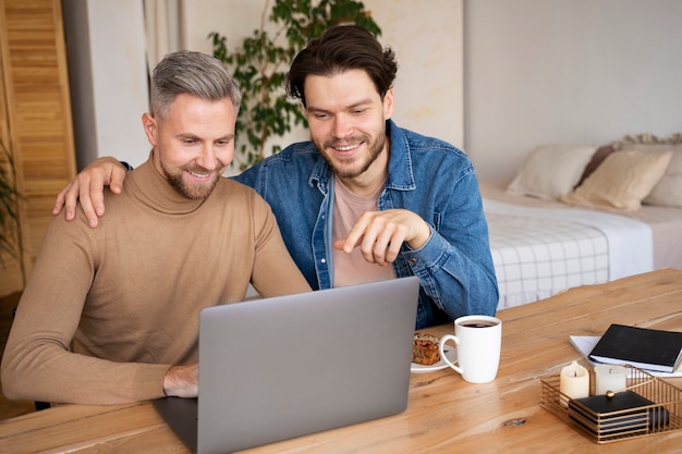 Close up on two dads looking at baby ultrasounds