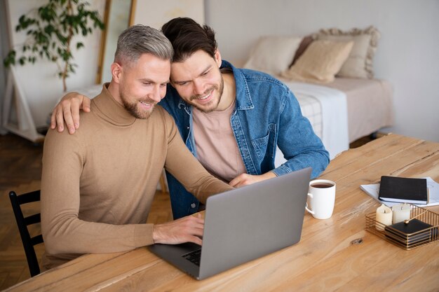 Close up on two dads looking at baby ultrasounds