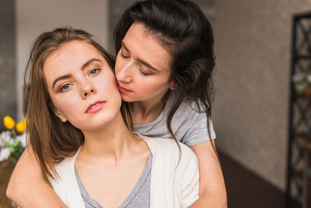 Close-up of two girlfriends loving each other