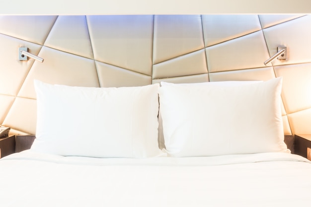 Close-up of two pillows with white covers