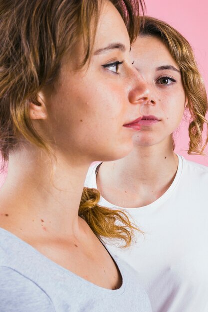 Close-up of two sister's face