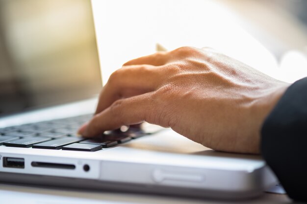 Close-up of typing male hands