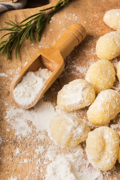 Close up uncooked potato gnocchi with flour