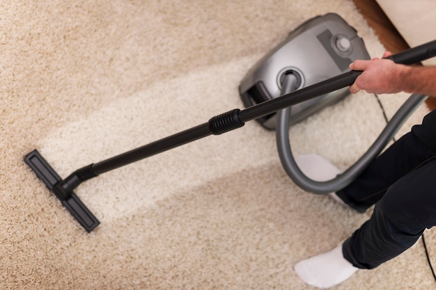 Close up of vacuuming a carpet