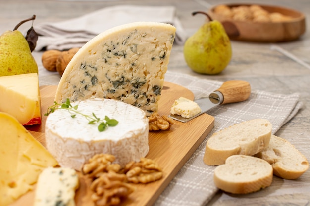 Close-up variety of cheese and fruits