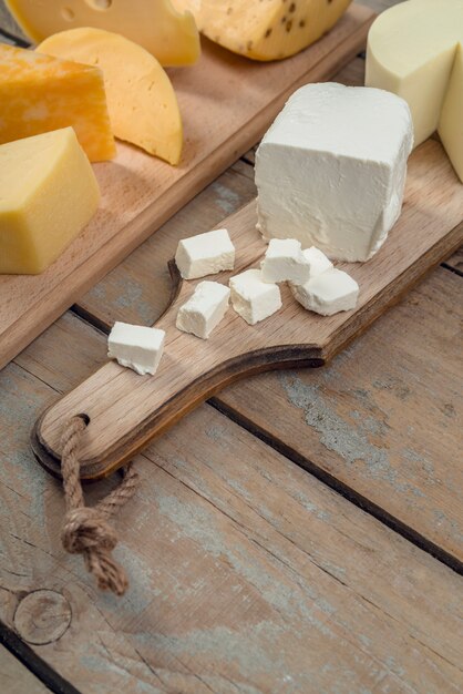 Close-up variety of delicious cheese on the table