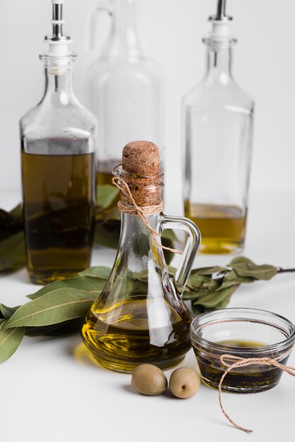 Download Premium Photo High Angle Olive Oil Bottle And Saucer With Yellow Olives And Copy Space PSD Mockup Templates