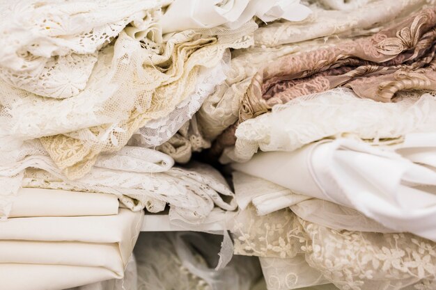 Close-up of various lace fabrics in tailor shop