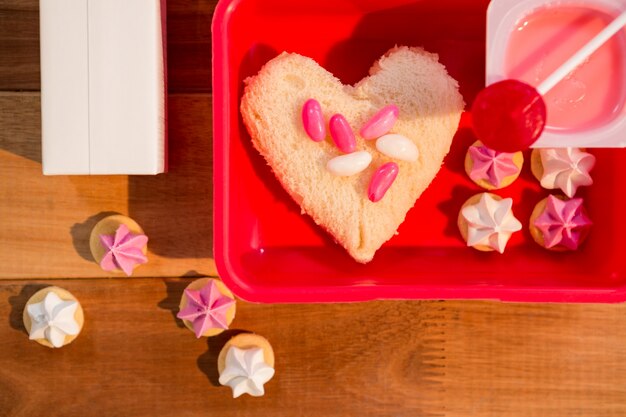 Close-up of various sweet food in lunch box