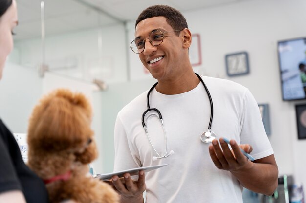 Close up veterinarian and cute dog