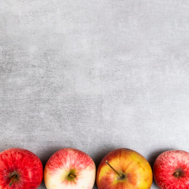 Close-up view of apples on wooden background with copy space