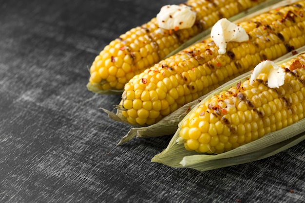 Close-up view of baked corn with butter