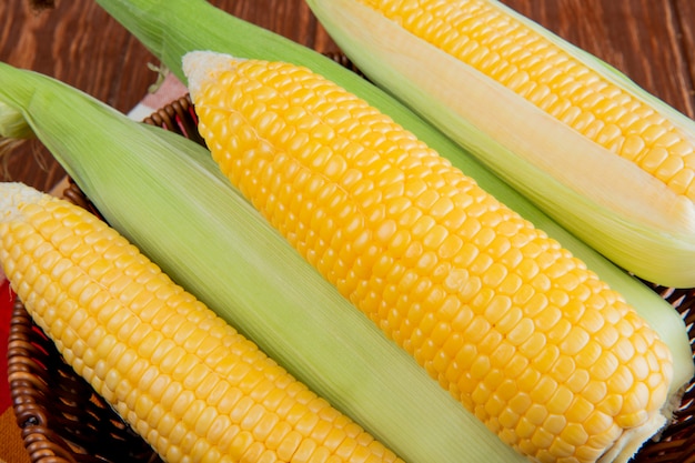 Close-up view of basket full of cooked and uncooked corns