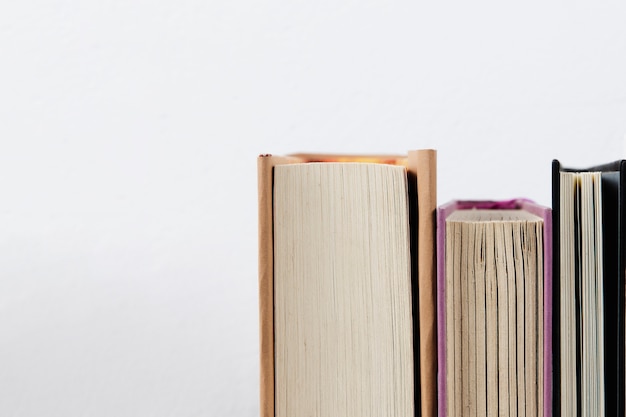 Close-up view of books with plain background