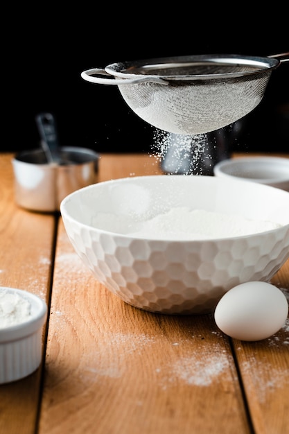 Close-up view of a bowl and sieve