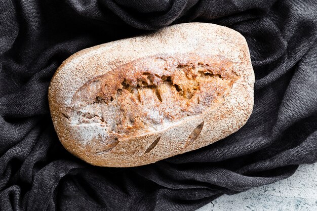 Close-up view of bread on black cloth