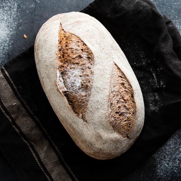 Close-up view of bread on black cloth