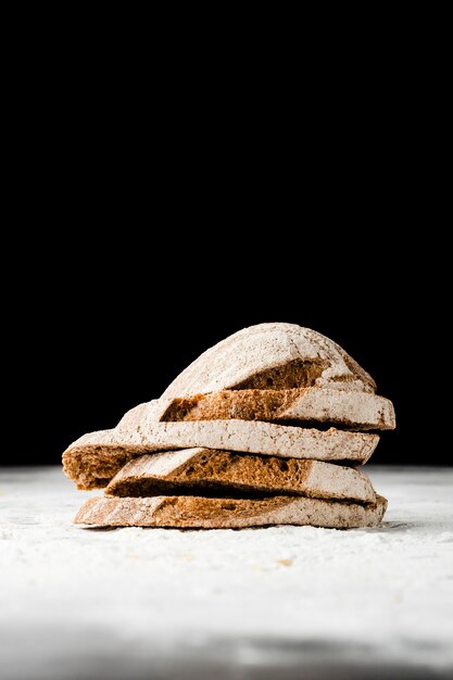 Close-up view of bread slices with black background
