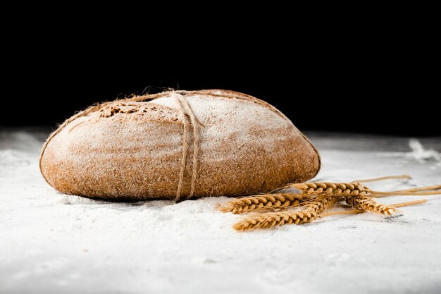 Close-up view of bread and wheat 