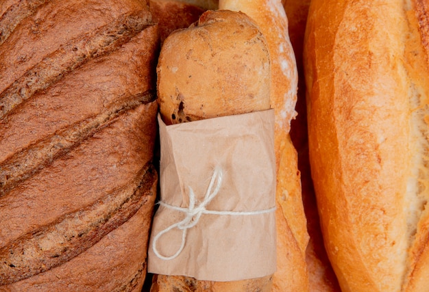 Close-up view of breads as black homemade crispy and vietnamese baguettes tandir 