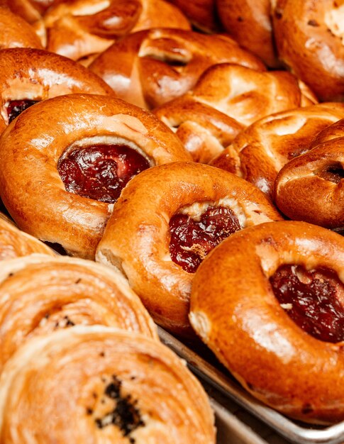 Close up view of bun with jam on tray