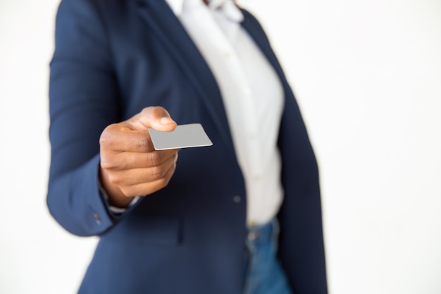 Close-up view of businesswoman holding card