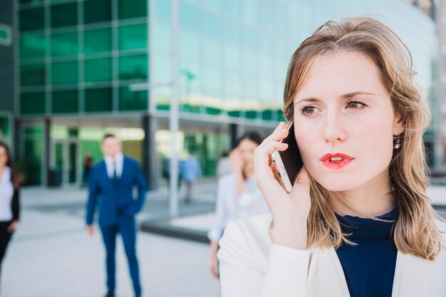 Close up view of businesswoman making a phone call