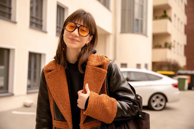 Close up view of caucasian woman walking on the street looking at camera