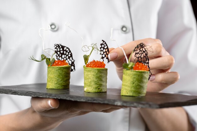 Close-up view of chef holding a food plate