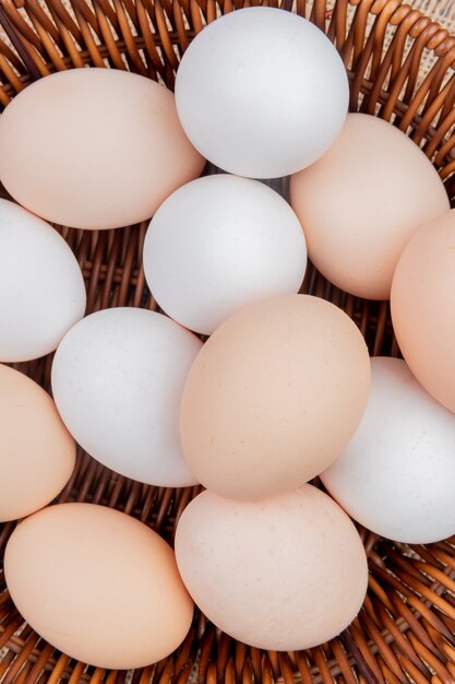 Close up view of chicken eggs on a bucket on sack cloth background