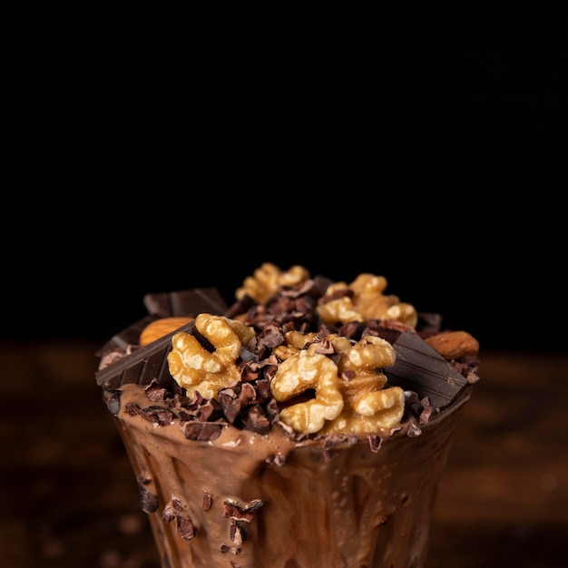 Close-up view of chocolate milkshake with walnuts