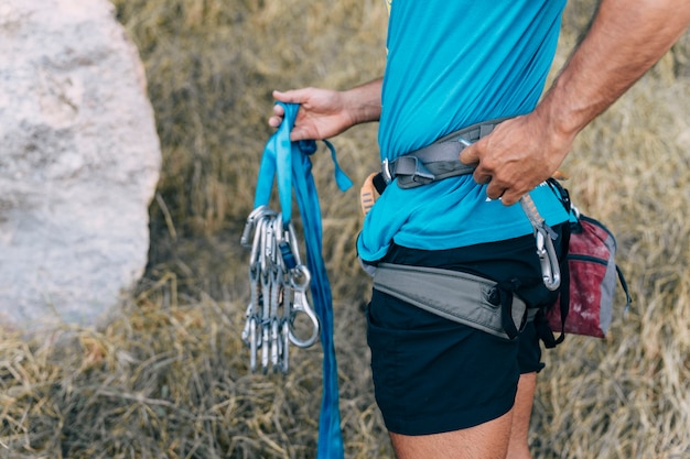 Free photo close up view of climber holding carabiners