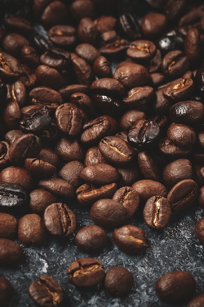 Close up view of coffee seeds on dark 